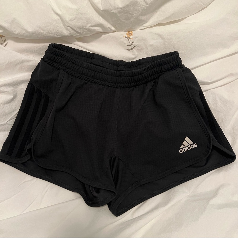 Dark gray adidas running shorts with black stripes